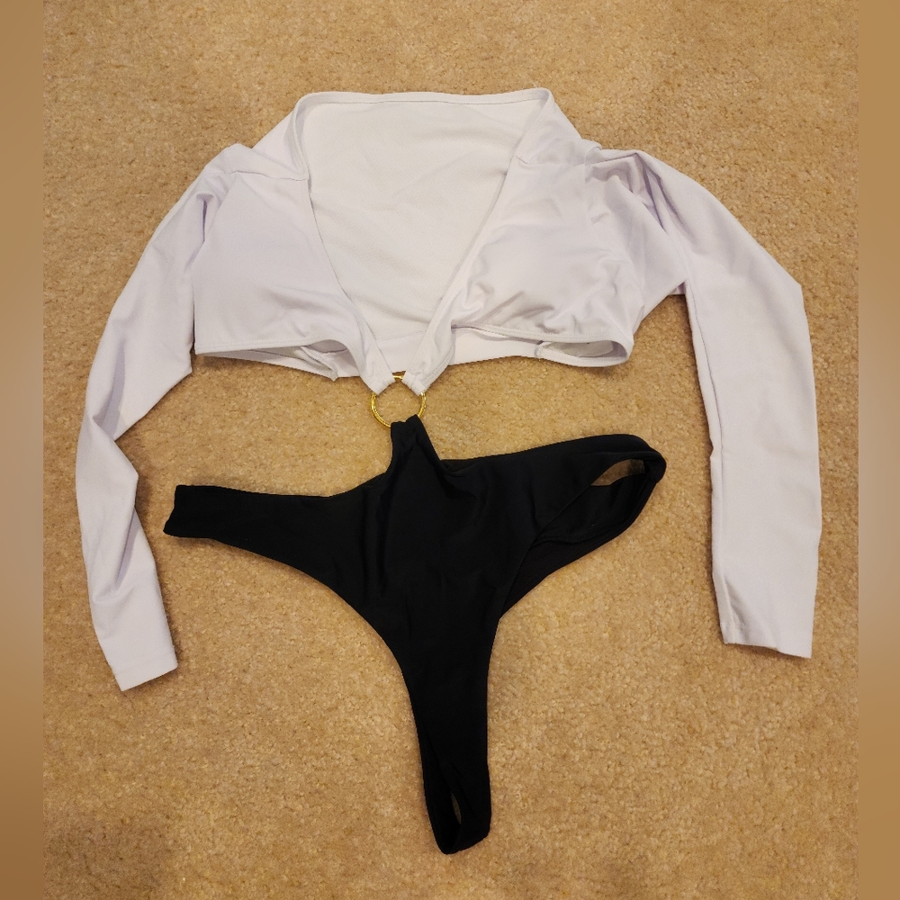 Brand new Black and White long sleeve Monokini with Gold ring. Size XL.